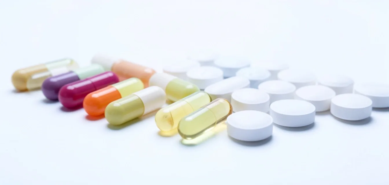Vitamin capsules and mineral tablets in studio lighting