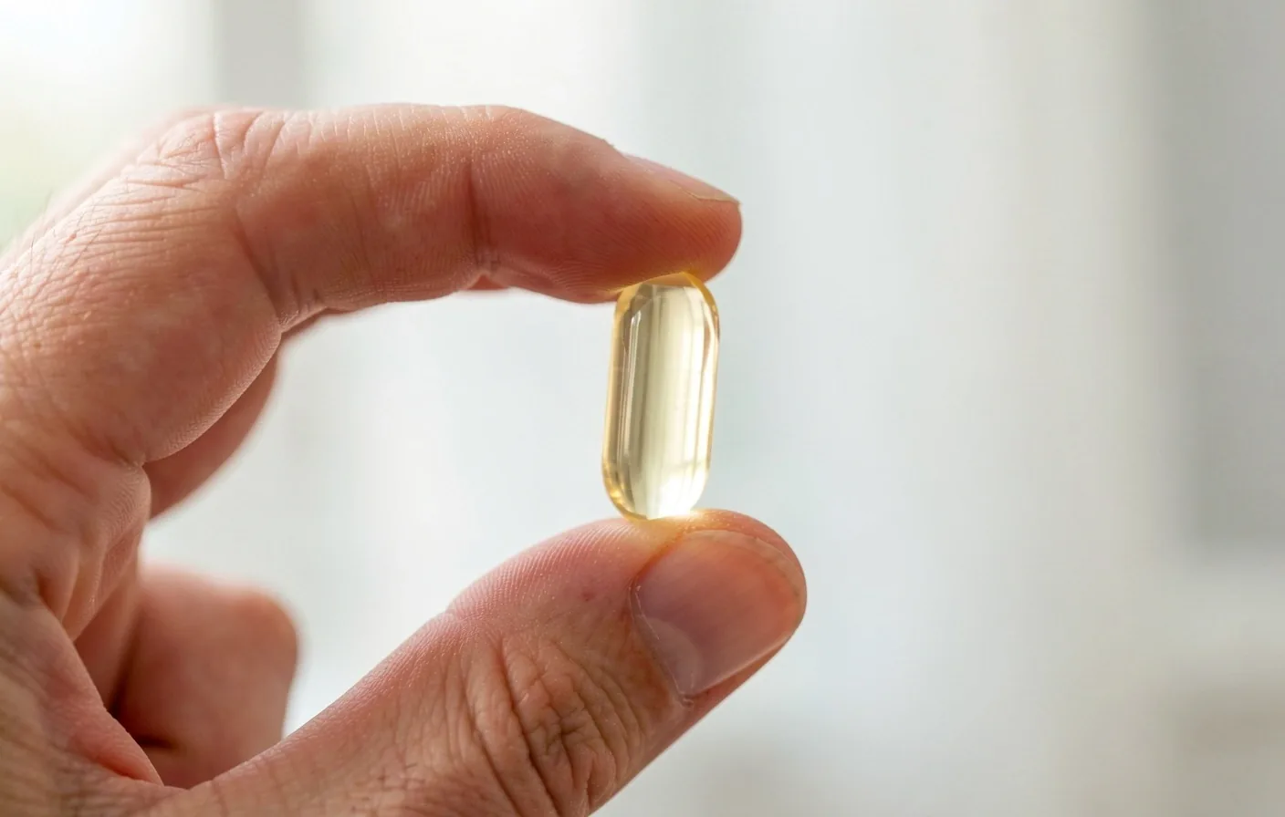 NutriMen daily vitamin and mineral capsules in studio lighting